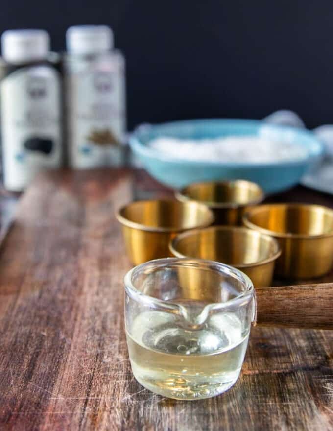 Close up of truffle oil in a glass cup