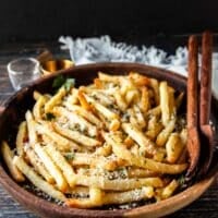 close up of truffle fries on a bowl with parsley