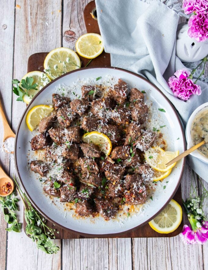 juicy air fryer steak bites with melted butter and parmesan 