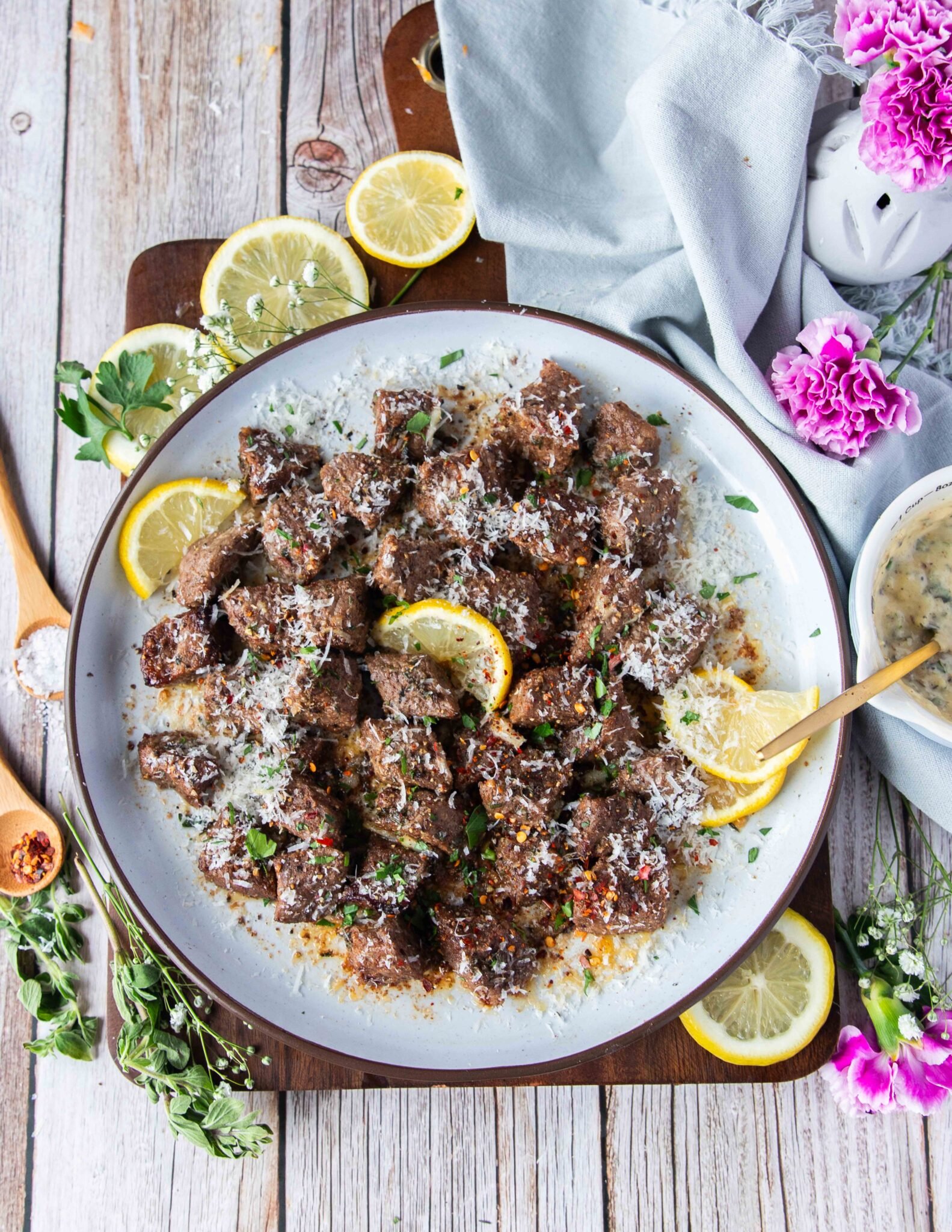 juicy air fryer steak bites with melted butter and parmesan