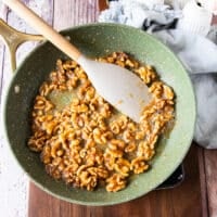 sugar mixture and walnuts in a skillet cooking