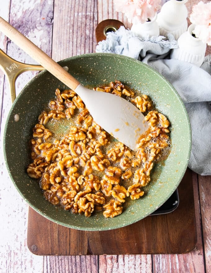 sugar mixture and walnuts in a skillet cooking