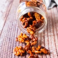 A close up of candied walnuts showing the clusters and glossy coat