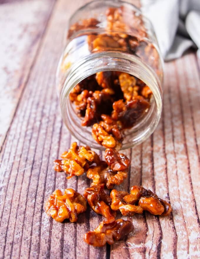 A close up of candied walnuts showing the clusters and glossy coat