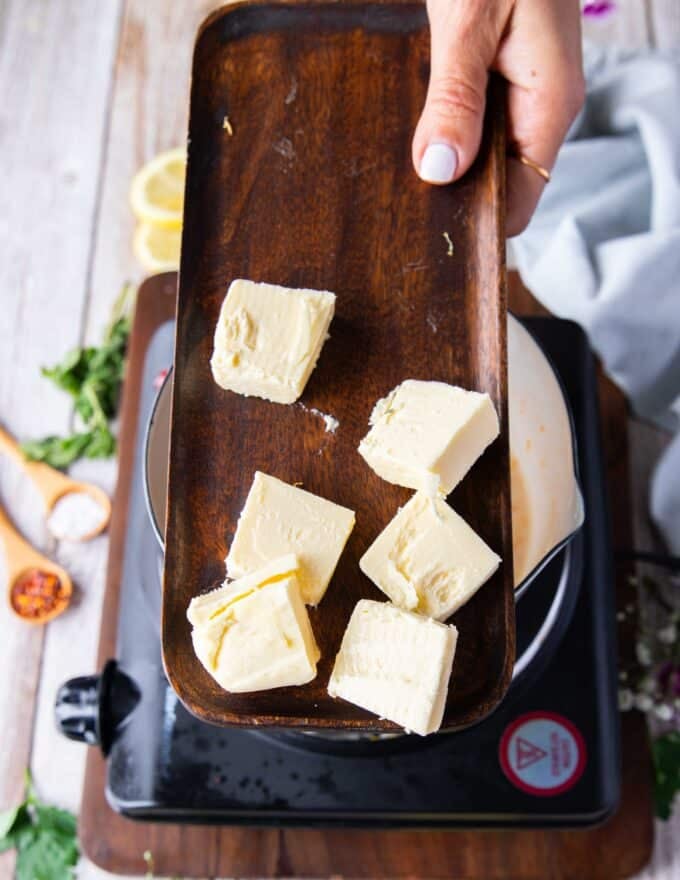 cold butter cubes in a plate to make beurre blanc emulsion