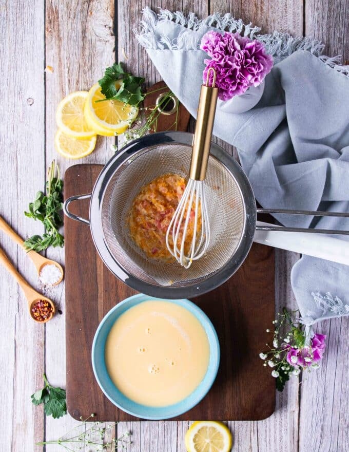 strained beurre blanc sauce in a bowl 