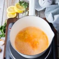 citrus zest is added to the pot to make citrus beurre blanc