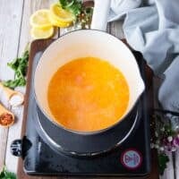 reduced liquid over beurre blanc sauce in a pot