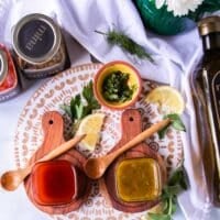 harissa vinaigrette in a bowl surrounded by salad