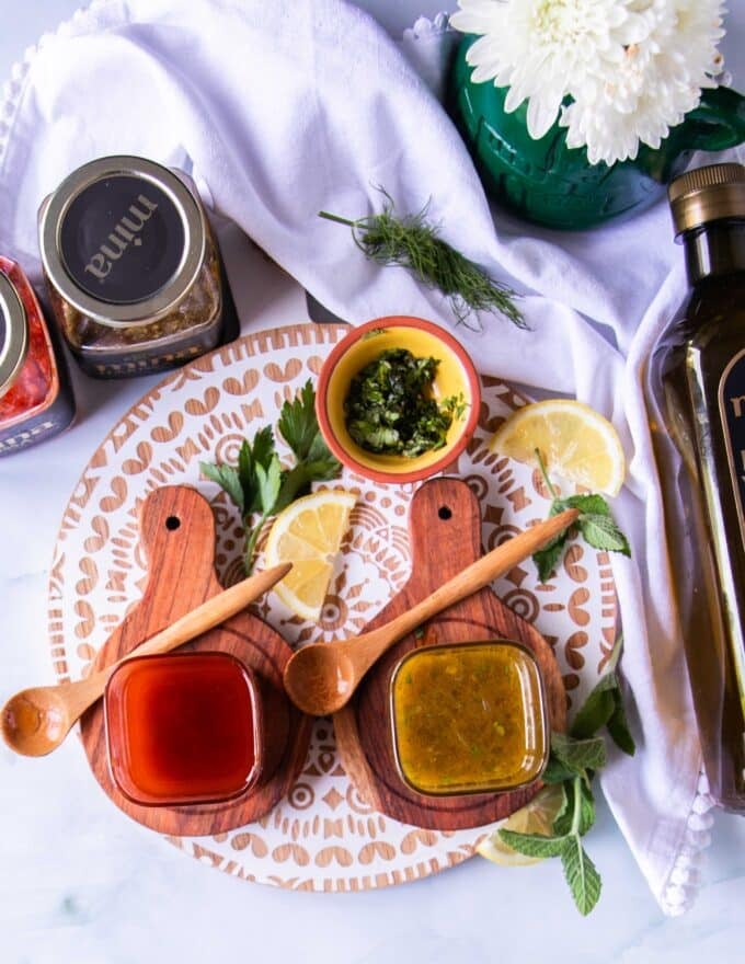 harissa vinaigrette in a bowl surrounded by salad