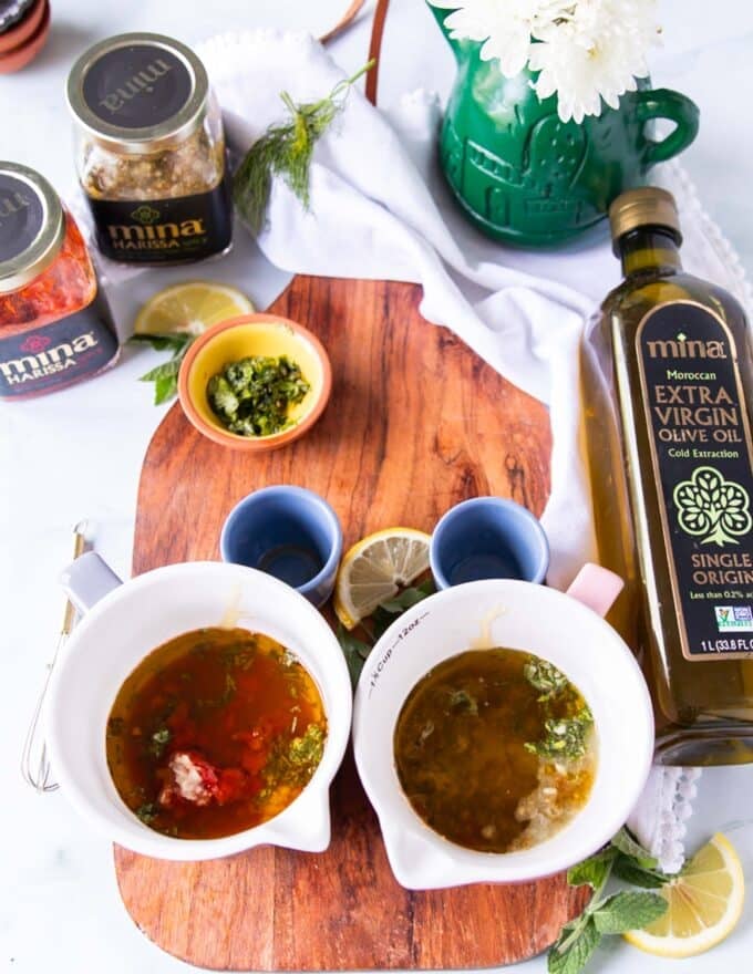 Side by side making a red harissa vinaigrette and a green harissa vinaigrette in two separate bowls 