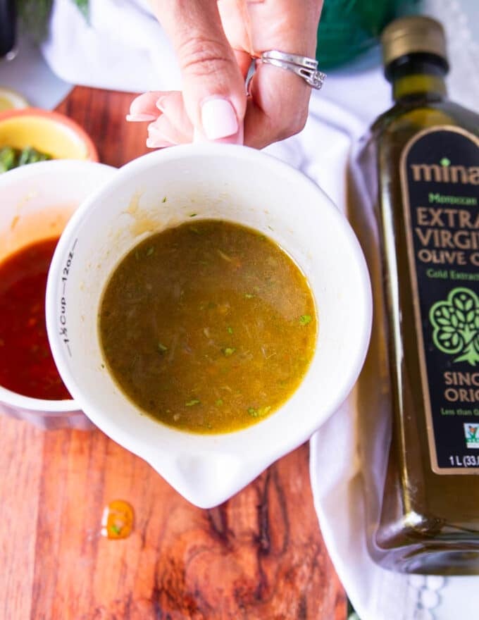 Green harissa vinaigrette in a bowl