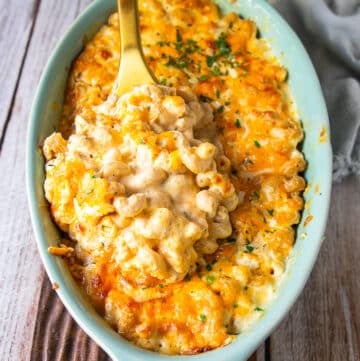 the best mac and cheese recipe showing creamy and luscious pasta in the sauce with cheesy pulls