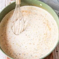 the cream and evaporated milk and seasoning added to the skillet