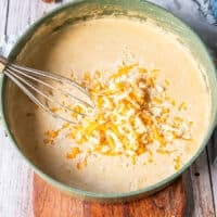 a third of the cheese is added to the bechamel sauce to make a cheesy sauce for mac and cheese