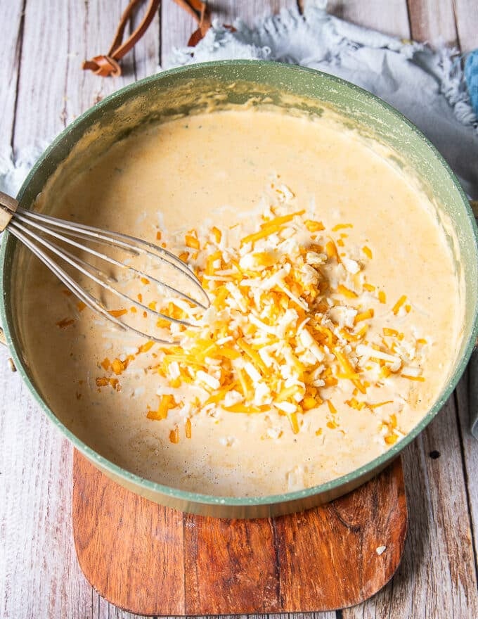 a third of the cheese is added to the bechamel sauce to make a cheesy sauce for mac and cheese 