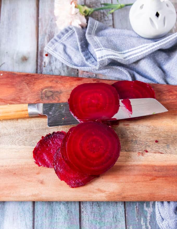 Another option of using a sharp knife to slice the beets for beet carpaccio is shown