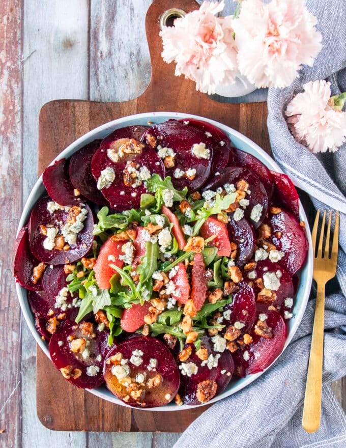 beet carpaccio with arugula, cheese, walnuts and orange segments