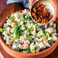 More candied walnuts is added over the top of the salad before serving