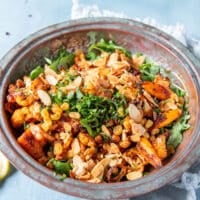 the tender roast cauliflower and crips chickpeas are added over the arugula, along with toasted almonds, herbs and raisins to make cauliflower salad