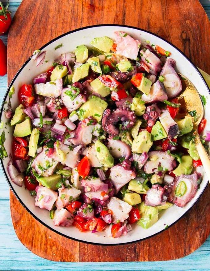 perfectly mixed octopus ceviche with chilies, lime and cilantro