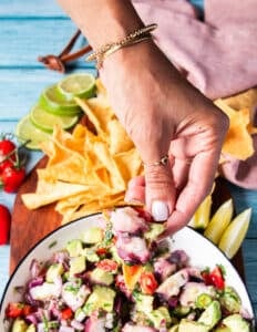close up of a tortilla chip loaded with octopus ceviche