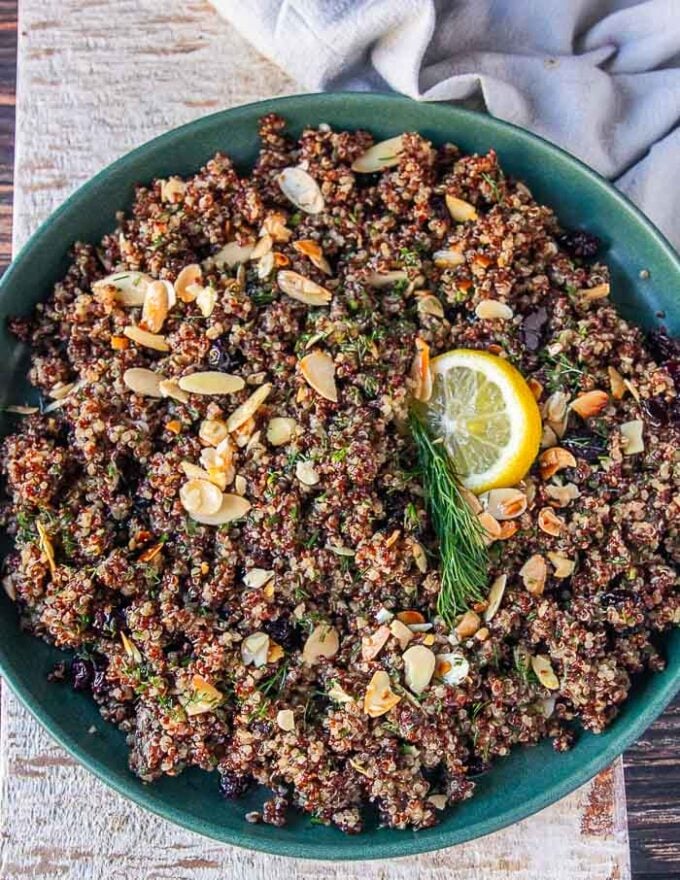 A plate of quinoa pilaf with dill, lemon, cranberries, nuts and. veggies
