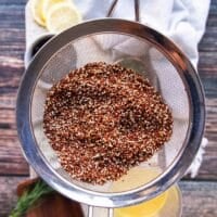 rinsed quinoa in a sieve to drain excess water before cooking