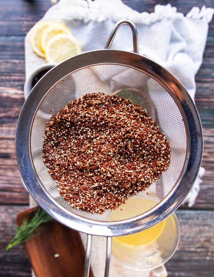 rinsed quinoa in a sieve to drain excess water before cooking