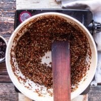quinoa is toasting in the pan for flavor