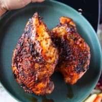 turkey breasts removed fro the air fryer on to a plate to rest