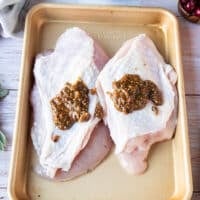 The butter mixture is added to the turkey breast