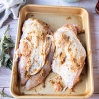 Fully slathered turkey breast with the butter mixture under the skin and everywhere