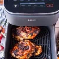 golden ad perfect turkey breast in the air fryer basket ready to flip
