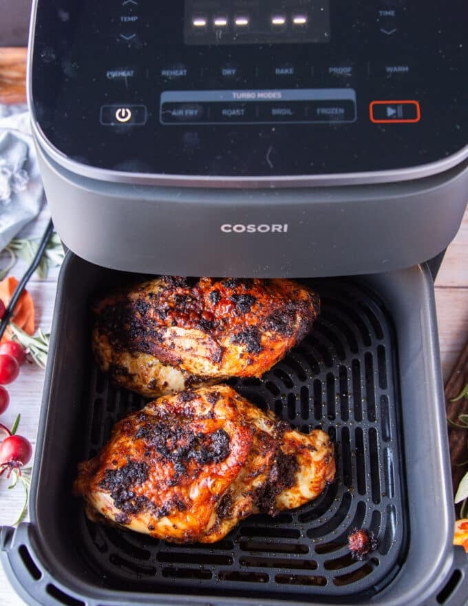 golden ad perfect turkey breast in the air fryer basket ready to flip