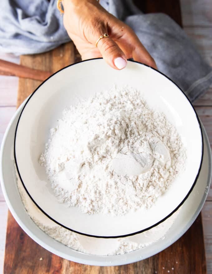 I cup of the dried flour mixture is removed on the side in a separate plate to dredge the fish in