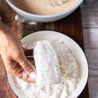 Fish dipped into a light coating of flour first