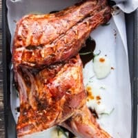 Lamb shoulder dressed up with balsamic marinade and placed in the roasting pan