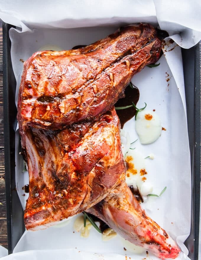 Lamb shoulder dressed up with balsamic marinade and placed in the roasting pan