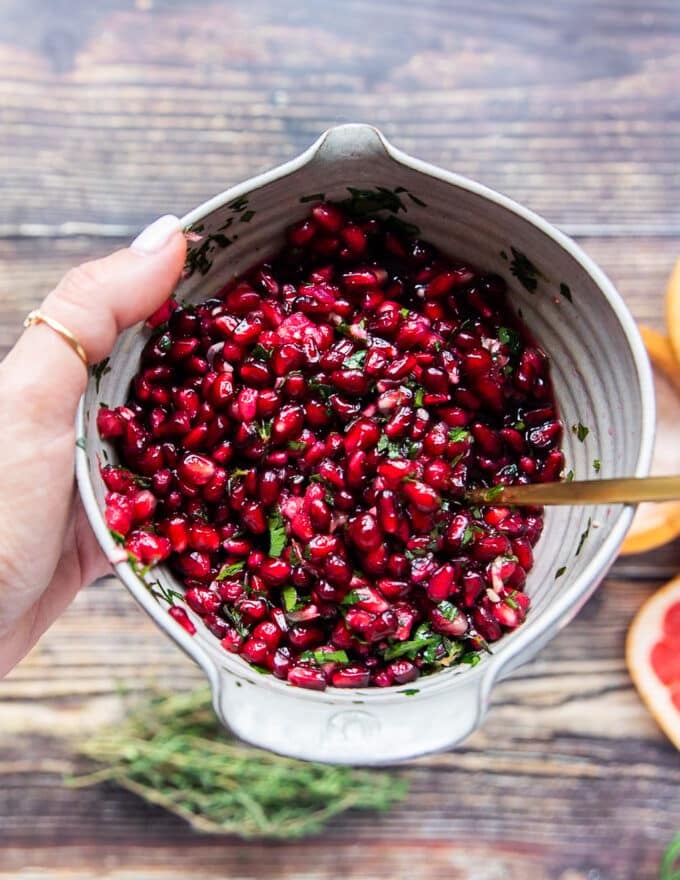 Pomegranate arils mixed with herbs and citrus and olive oil to drizzle over the lamb
