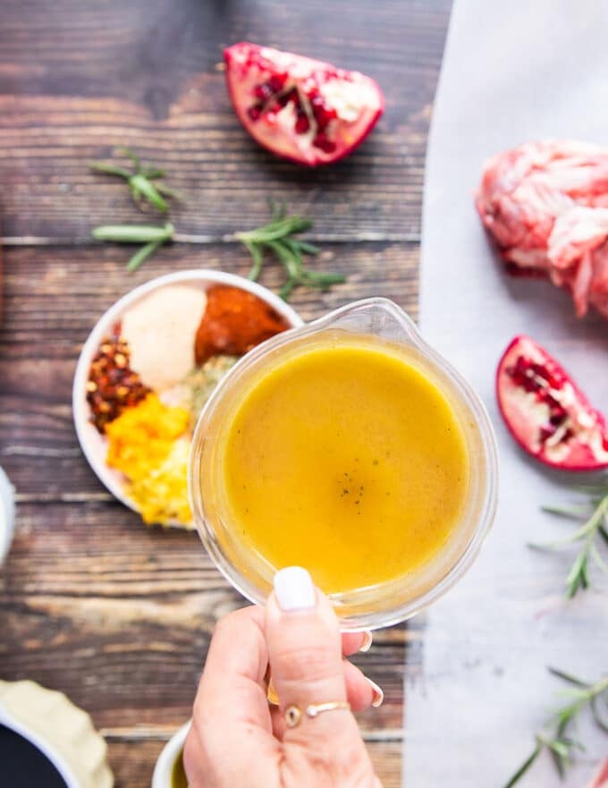 Stock being poured in the roasting pan 