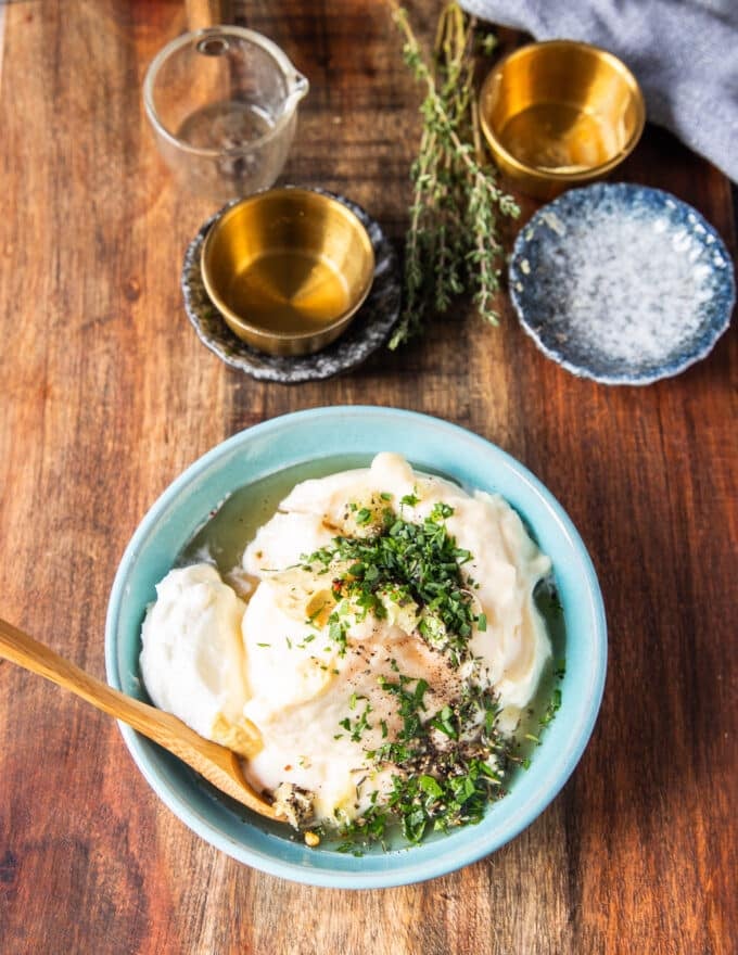 All ingredients to make truffle aioli are added into a bowl 