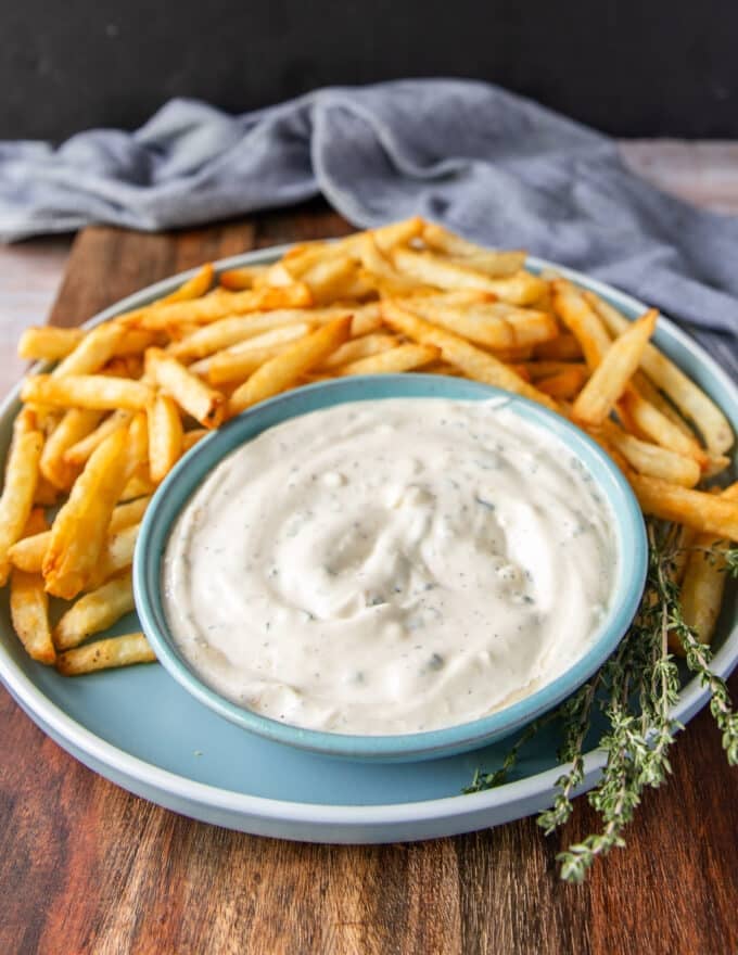 silky smooth truffle aioli on a plate of fries