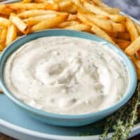 Truffle aioli so silky and smooth next to a plate of fries