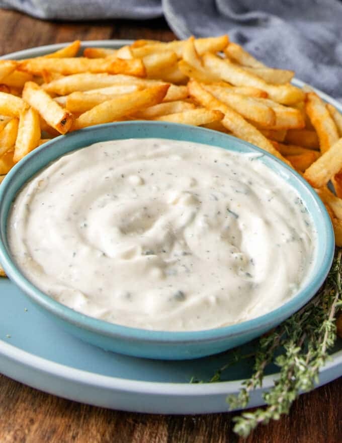 Truffle aioli so silky and smooth next to a plate of fries