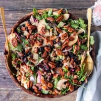 apple salad with greens apples maple vinaigrette and maple pecans in a bowl