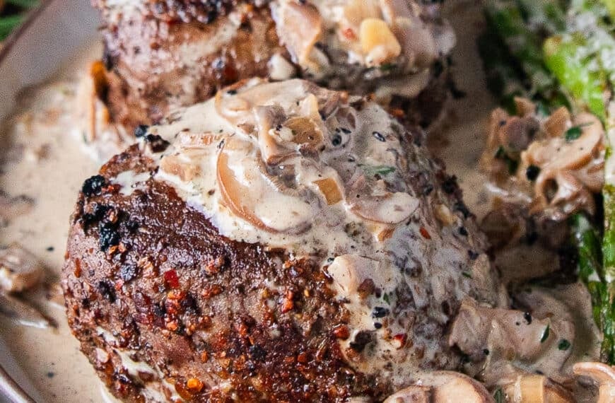 Perfectly cooked filet mignon drenched in creaky mushroom sauce for steak