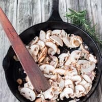making creamy mushroom sauce for steak, sauteing mushroom in a hot pan