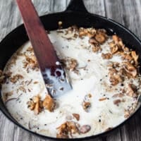 cream, mushard, herbs and Worcestershire sauce is added to the pan