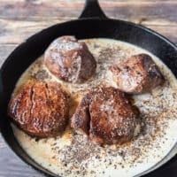 deglazing the steak drippings in the pan, adding dijon, Worcestershire , stock, peppercorns and seasoning to start the sauce